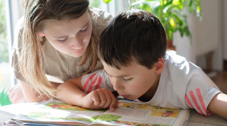 Child with Mother reading from book